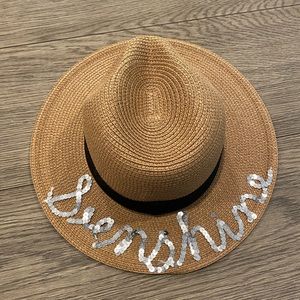 Women’s sun or beach hat decorated with “sunshine”
